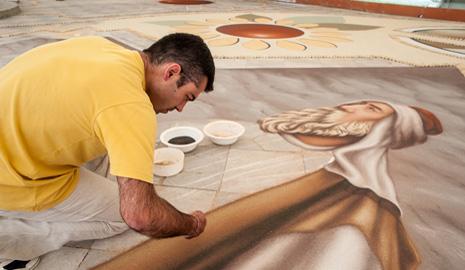 Man creating sand art